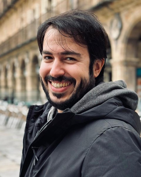 Dr. Andrés Gutiérrez, smiling, outdoors in a winter coat